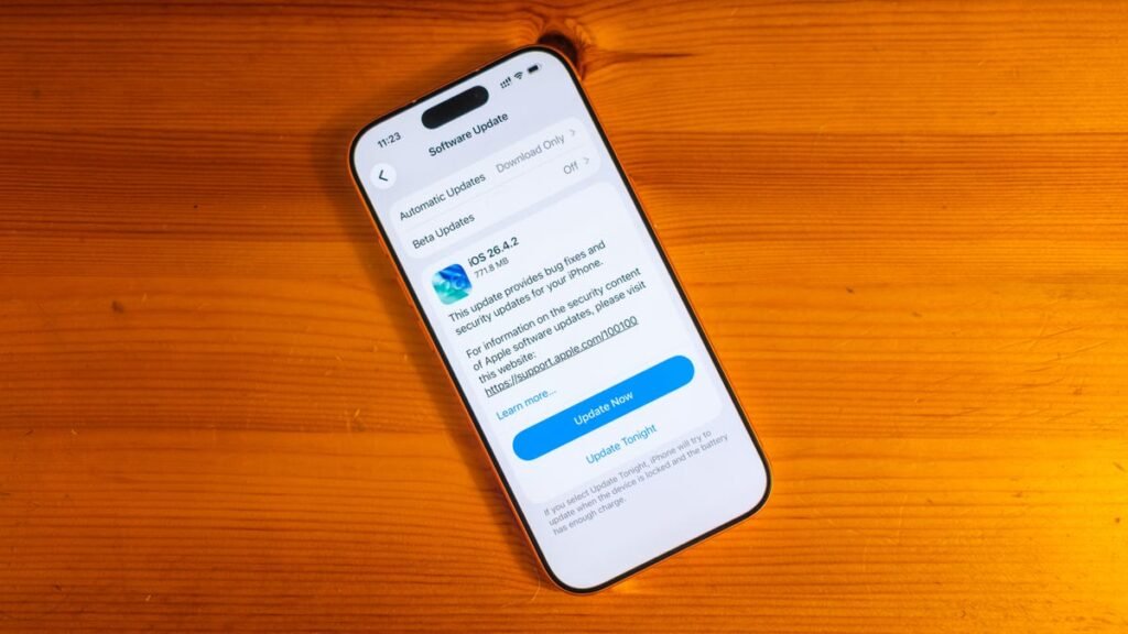 A phone showing the iOS 26.4.2 update to be installed.