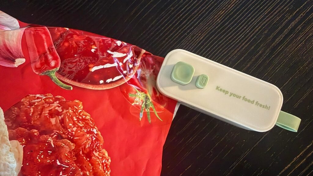 heated bag sealer being used on bag of chips