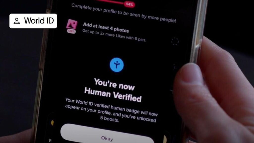 A hand holds a cell phone with the words You're now Human Verified on screen.