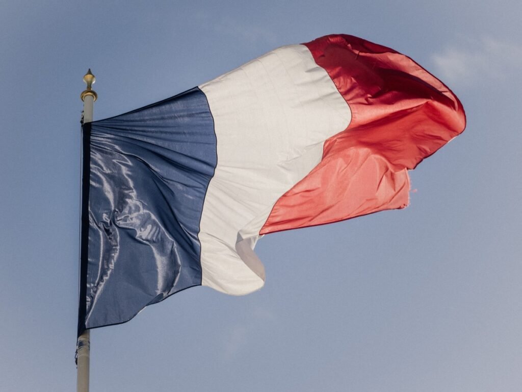 Photo illustration of the blue white and red French flag at the Elysee Presidential Palace in Paris France on April 15, 2026.