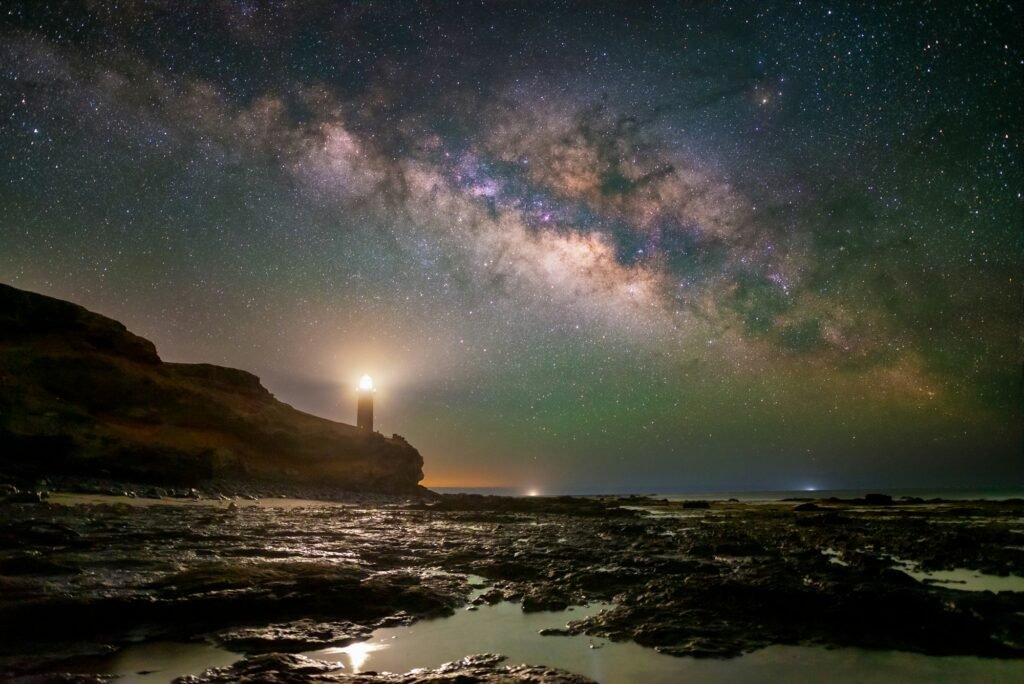 a light house by night under the stars