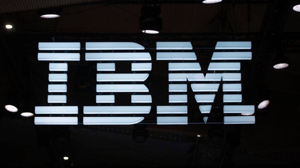 A large IBM logo at a conference exhibition.