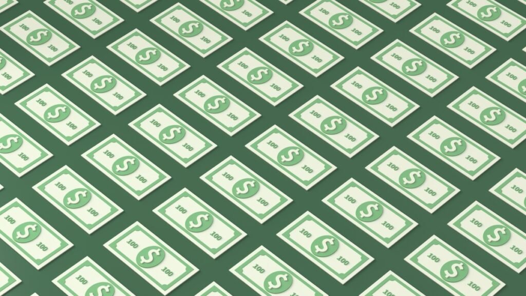 An illustration of patterned 100 dollar bills on a green background