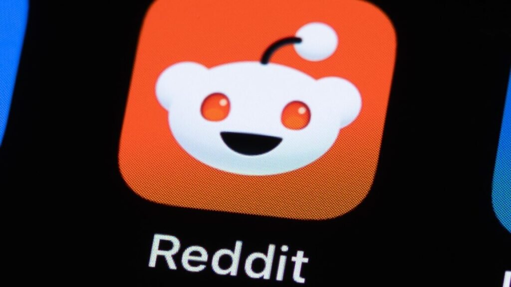 A Reddit app icon on a phone screen.