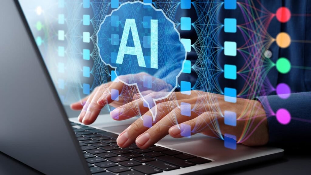 two hands typing on a laptop while a holograph of a brain with multiple lines feeding into it, inside the brain are the letters AI