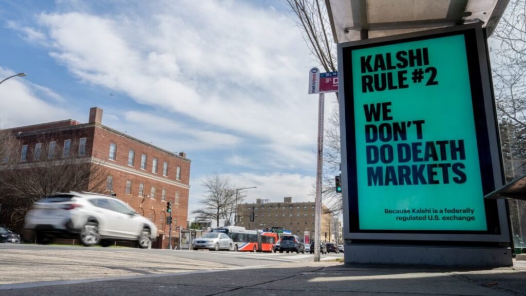 An advertisement at a bus stop says, "Kalshi rule #2: We don't do death markets," and that "Kalshi is a federally regulated US exchange."