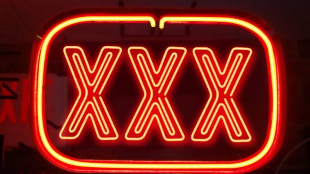 Red neon light of triple X's.