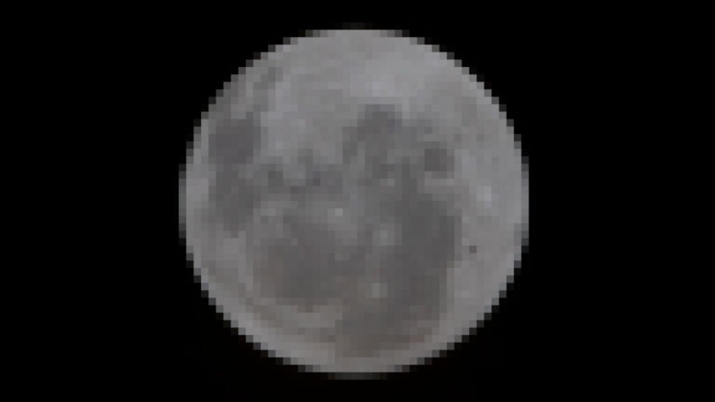 A pixelated photo of a gray moon set against the blackness of space