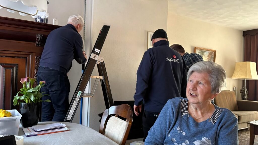 a Dutch senior watches as AI fall detection is installed in her home
