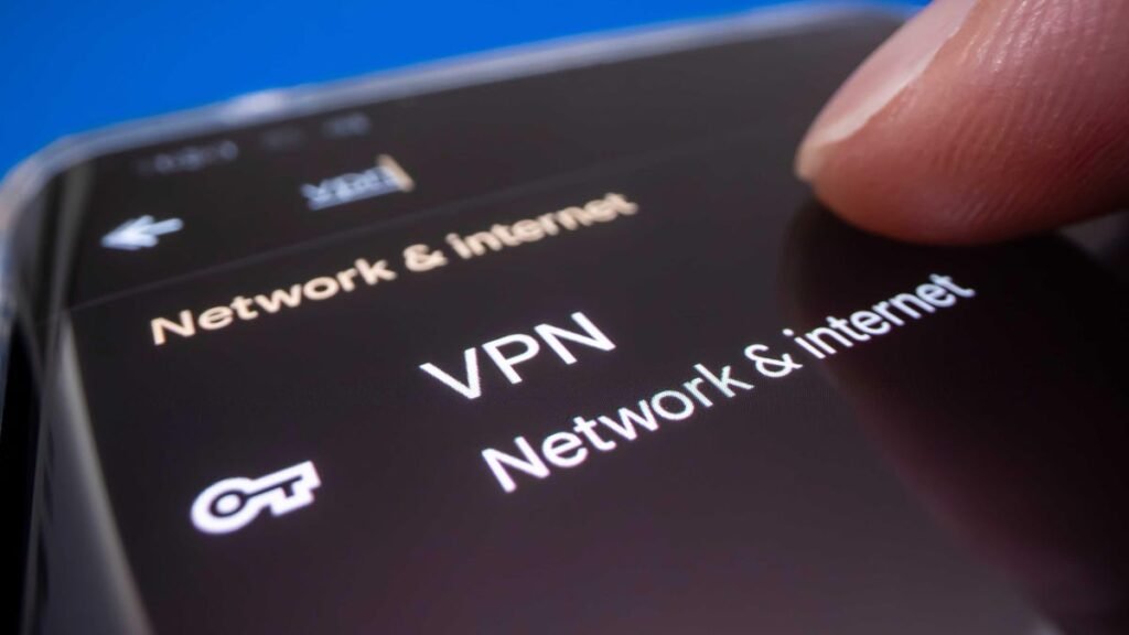 A finger selects a VPN setting on an Android phone.
