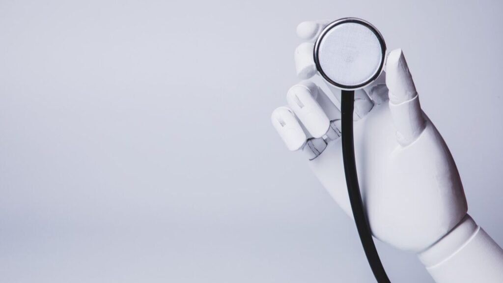 A robot hand holding a stethoscope.