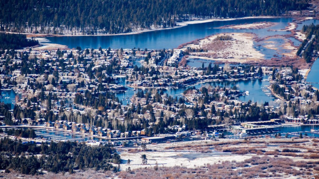 Aerial view of a residential area in South Lake Tahoe, with houses built on the shores of man made canals, California; sunny winter day.