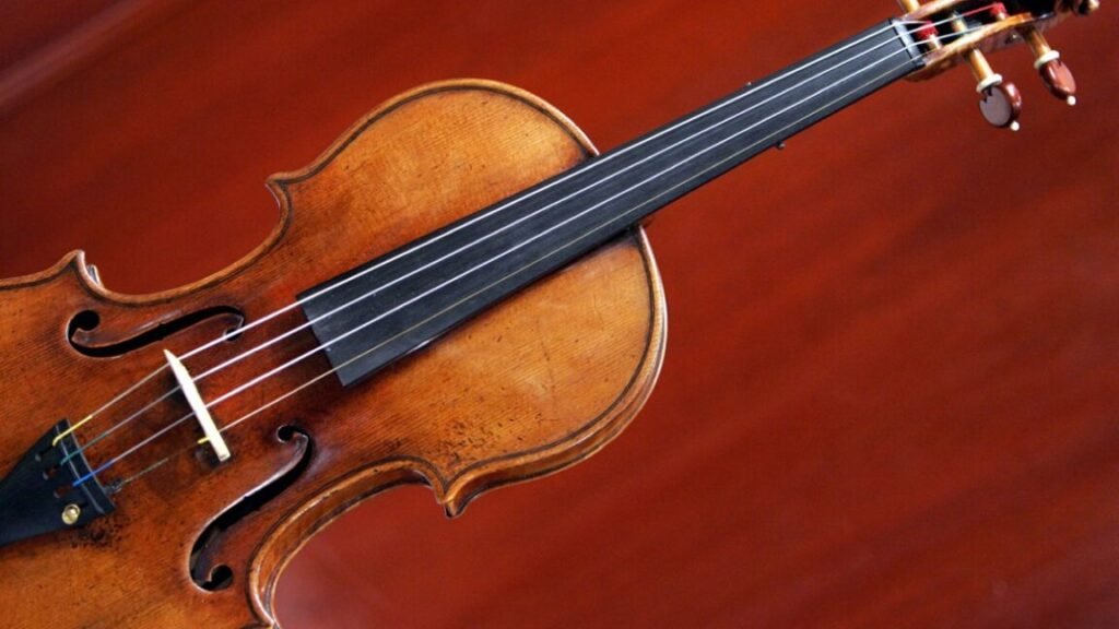Violin against a red background.
