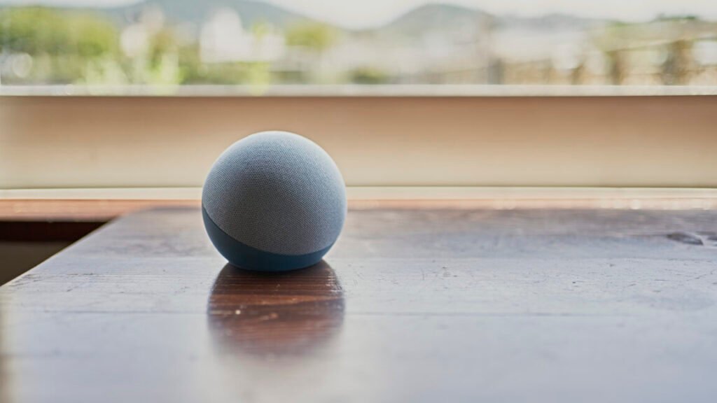 Marketer that claimed it could tap devices for ad targeting will pay $880K settlement An Amazon Echo Dot smart speaker on a table by a window.
