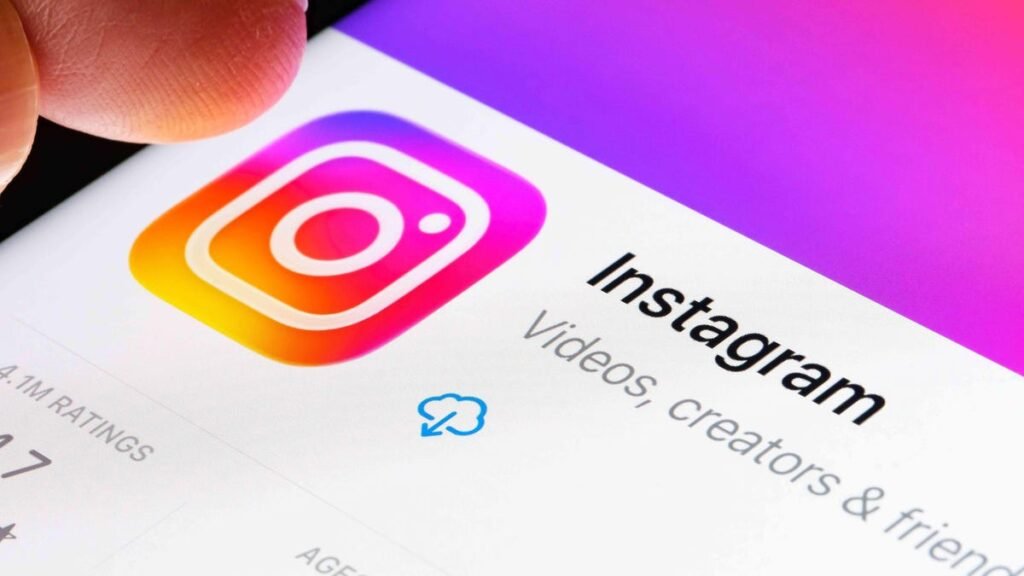 Instagram app logo shows close up on a phone.