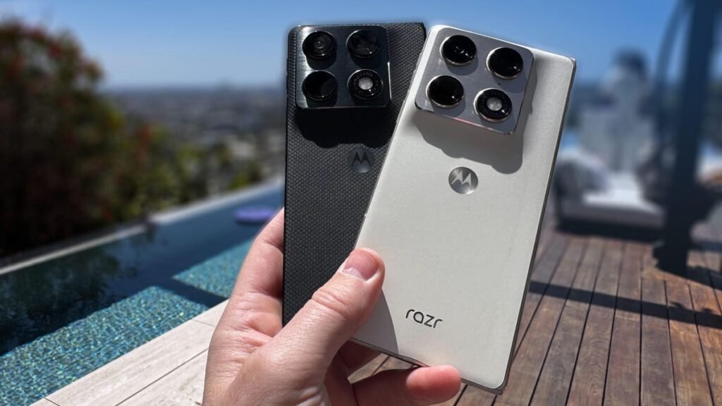 Two phones, one black and one white, held up in front of a reflective pool.