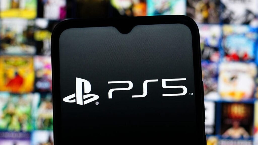 A phone with the PlayStation 5 logo is in the foreground, with blurry PlayStation-exclusive game splash art in the background.