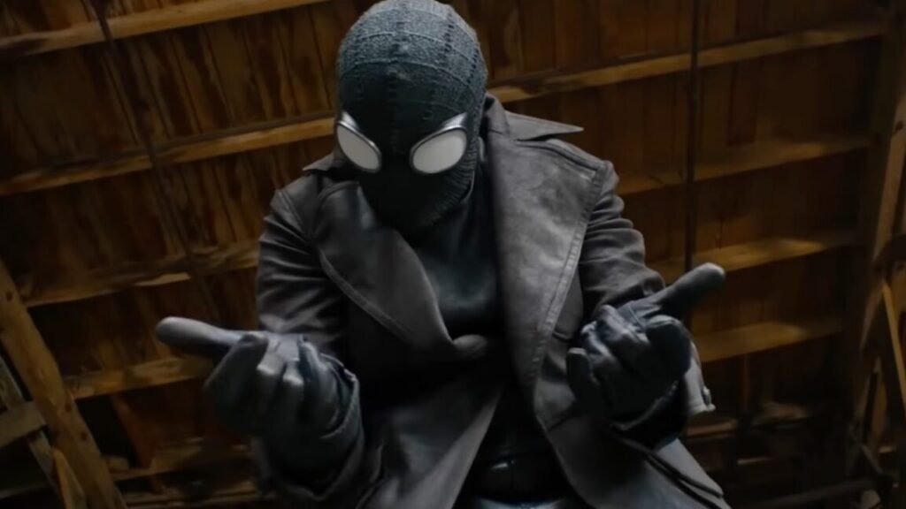 Spider-Noir’s final trailer leans into the deadpan humor closeup of a man in black spiderman suit holding both hands out in front of him, ready to fire out webbing