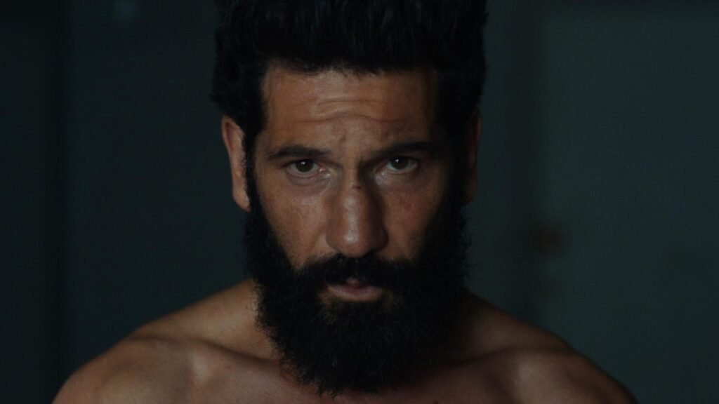 jon bernthal as frank castle, shirtless and looking contemplative