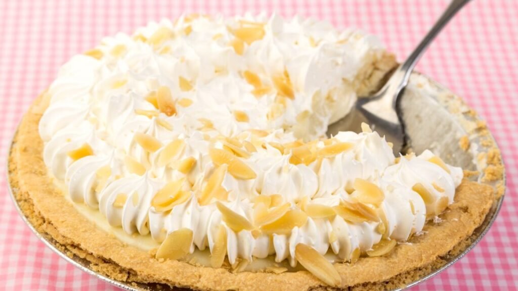 A banana cream pie with a fork sticking out of it