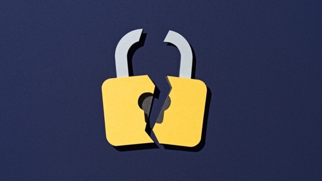 Paper Craft of Cracked Yellow Lock on Purple Background Front View, Data Security Concept.