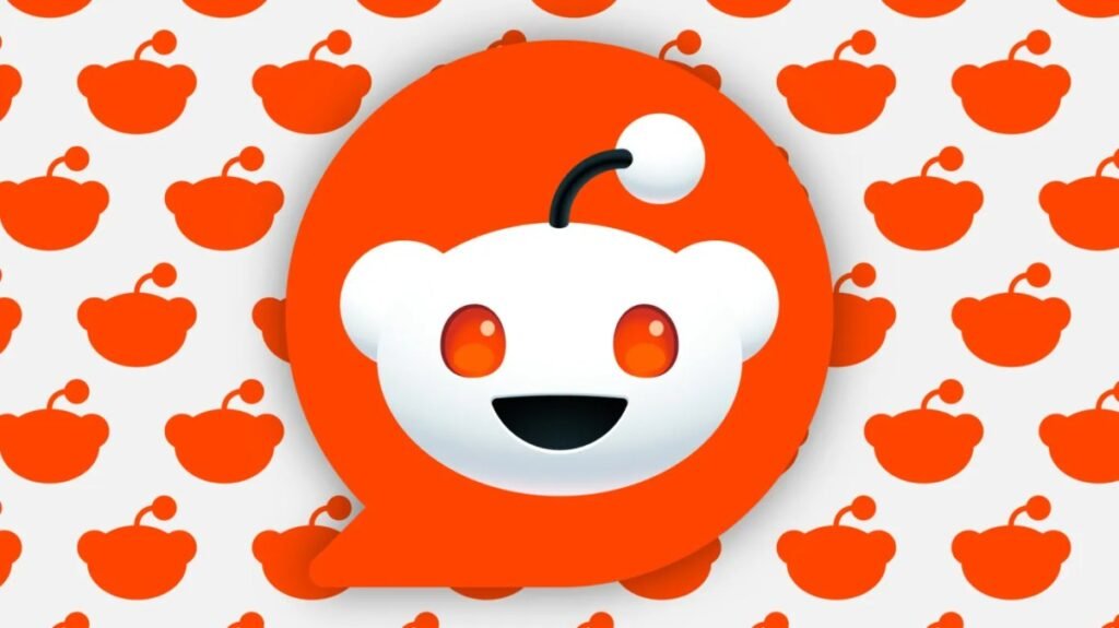 Reddit reports a solid quarter but shows signs of AI’s impact large Reddit logo overlaying background of smaller logo silhouettes