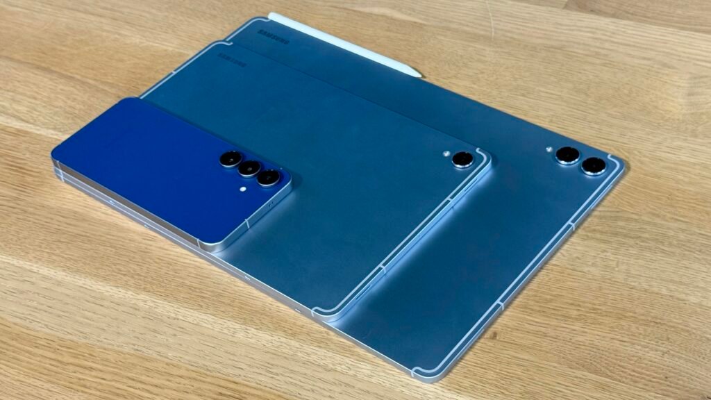 The Galaxy S25 FE, Galaxy Tab S11 and Galaxy Tab S11 Ultra on a wooden table.
