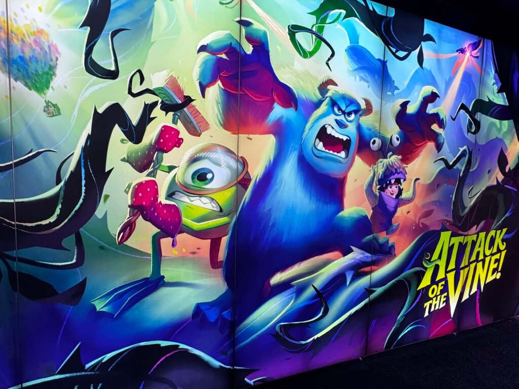 A wall art image of the Monsters Inc. characters being attacked by vines