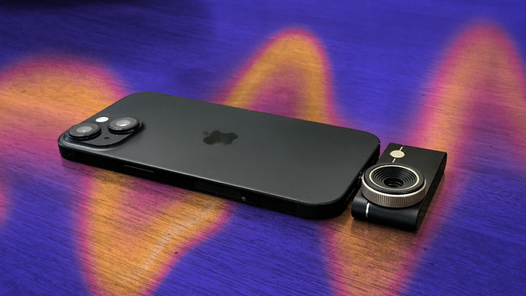 A thermal imaging add-on to a dark phone against a CNET background.