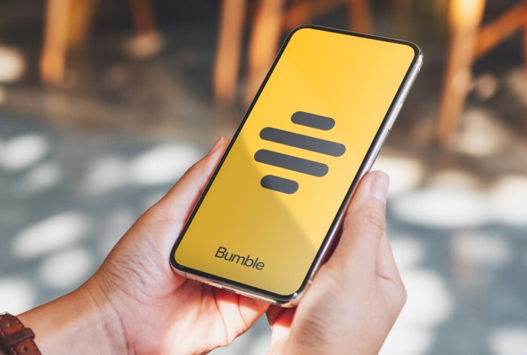 Bumble teases a swipe-free future as it doubles down on IRL meetups Bumble logo on smartphone screen