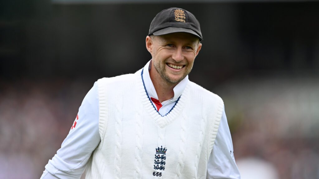 England cricketer Joe Root smiling, wearing a cap.