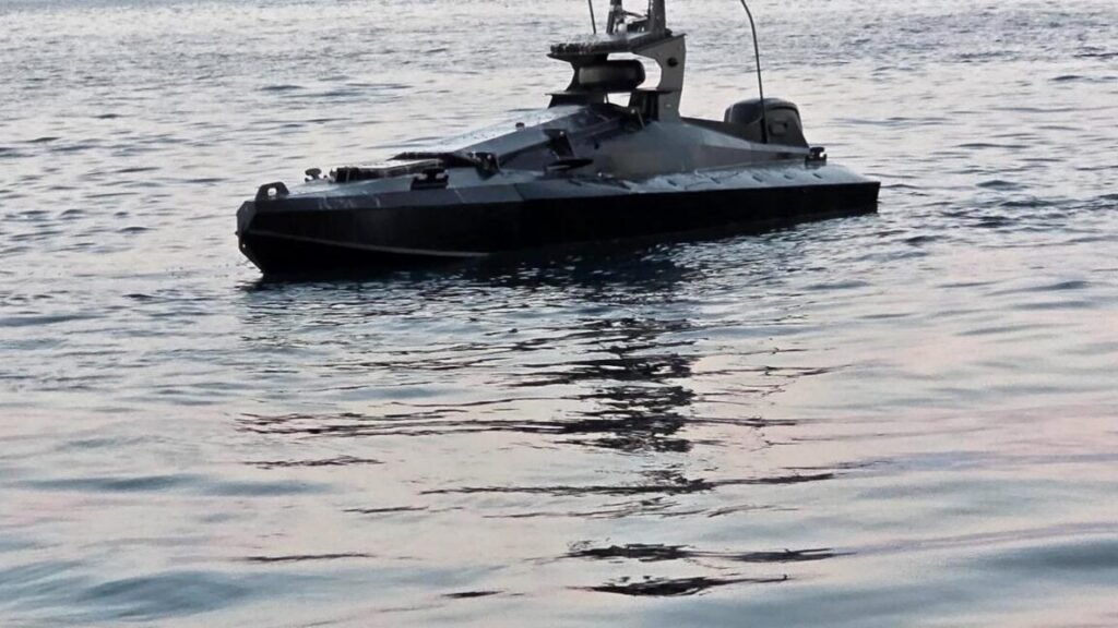 A drone boat loaded with explosives found near Romania's Neptun Deep gas project in the Black Sea. The uncrewed surface vessel is painted black.