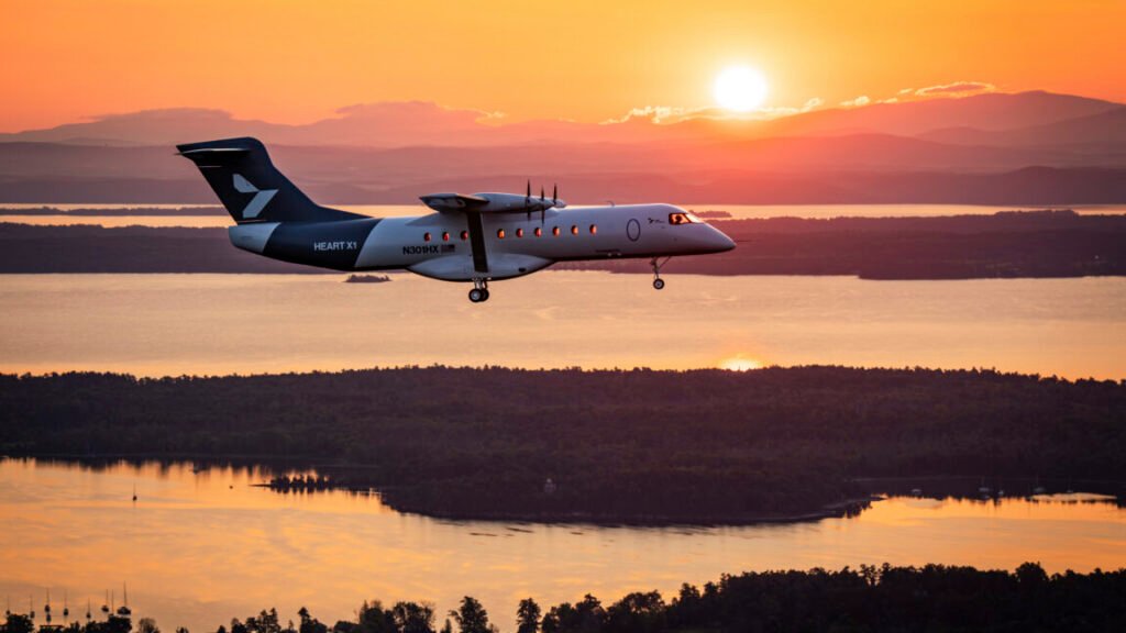 Heart Aerospace's X1 demonstrator aircraft flies over lakes and forest set against the rising sun near Plattsburgh International Airport in upstate New York on August 12.