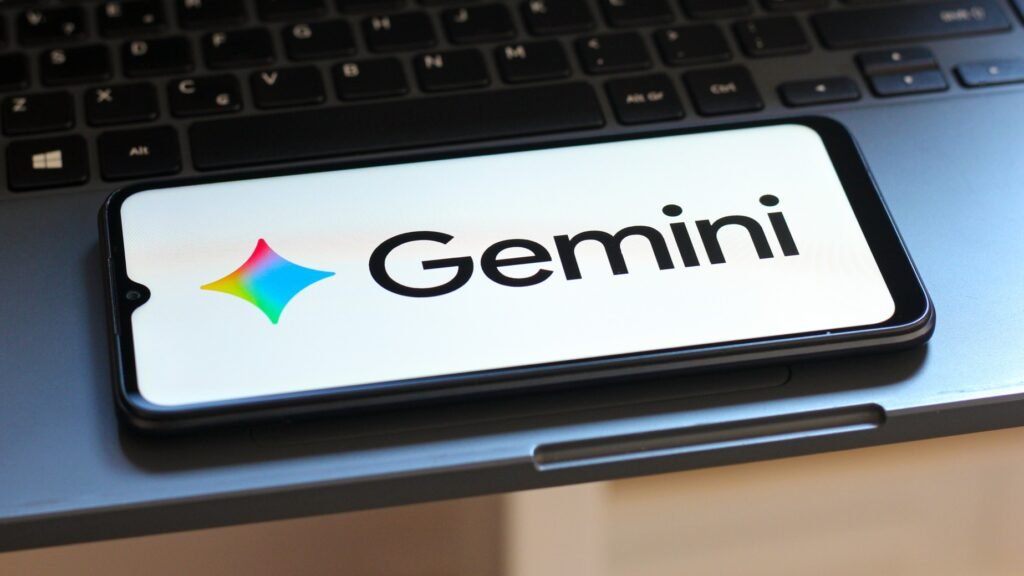 Google Gemini logo on a smartphone that's sitting on a keyboard.