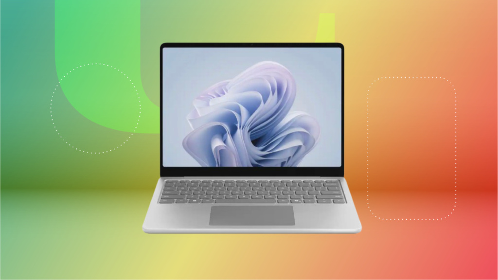 Microsoft surface laptop against green, yellow and red CNET background