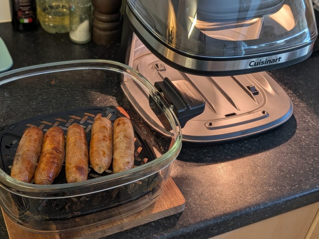 4QT air fryer bowl sitting on a wooden trivet