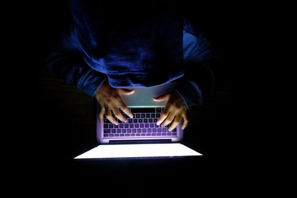 In a first, US will allow some private firms to carry out cyberattacks Hooded hacker Man with laptop stealing personal data from internet