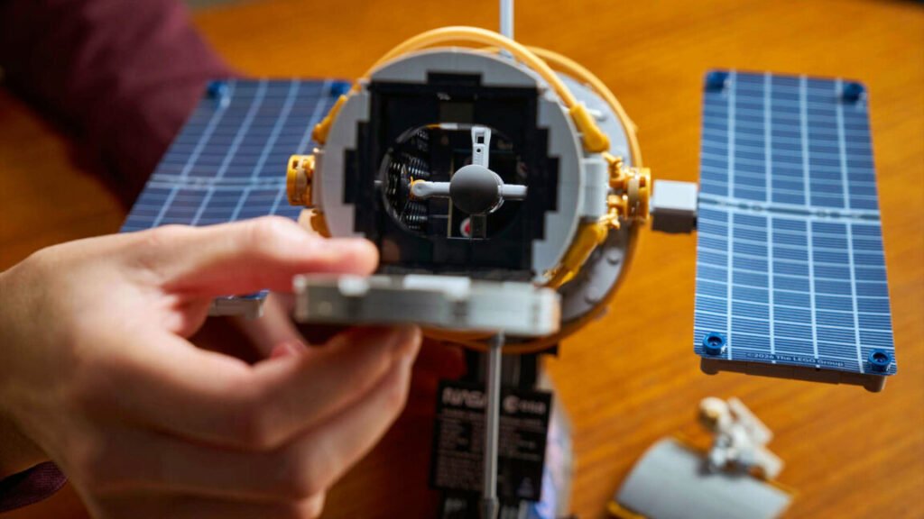 LEGO deploys Hubble Space Telescope as detailed desktop model a photo of a toy brick-built space telescope from the vantage point of looking through the open aperture door.
