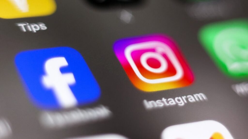 Facebook and Instagram app icons on a phone screen.