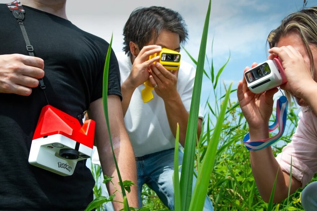 Adults using Pokemon cameras outside. All three variations are featured.