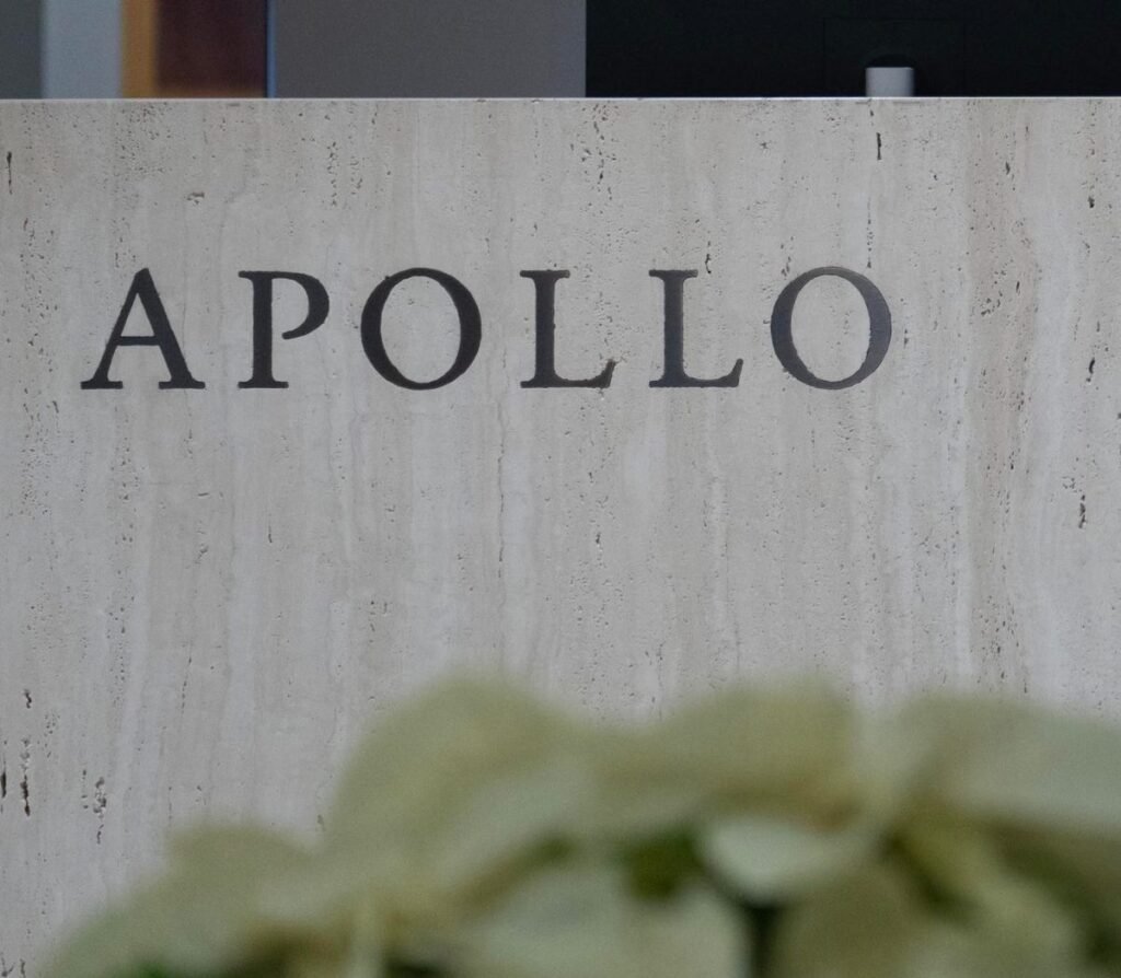 Apollo Global Management signage in New York, US, on Tuesday, Dec. 5, 2023. Apollo's CEO said it's getting harder for active managers to beat indexes in public markets and that it is easier for investors to find alpha in private markets. Photographer: Jeenah Moon/Bloomberg via Getty Images