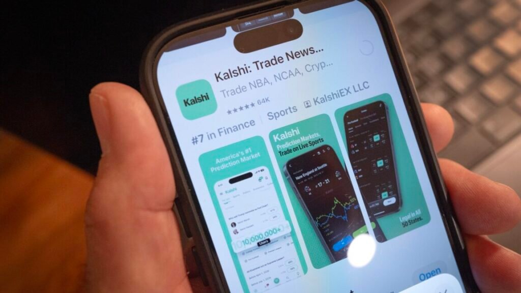 State judge orders Kalshi to stop offering sports bets and other wagers A person's hand holding a smartphone that displays the app store listing for Kalshi's prediction-market app.