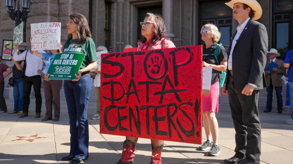 People hold signs opposing data centers during ap protest at the Capitol in Austin on July 27, 2026.
