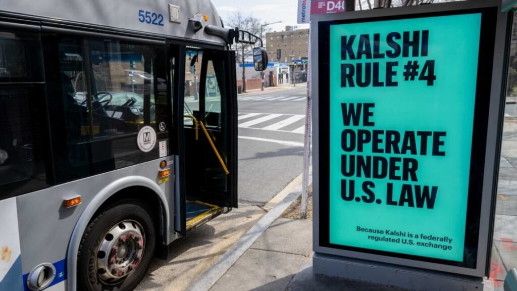 A Kalshi advertisement at a bus stop displays the text, "We operate under US law because Kalshi is a federally regulated US exchange."