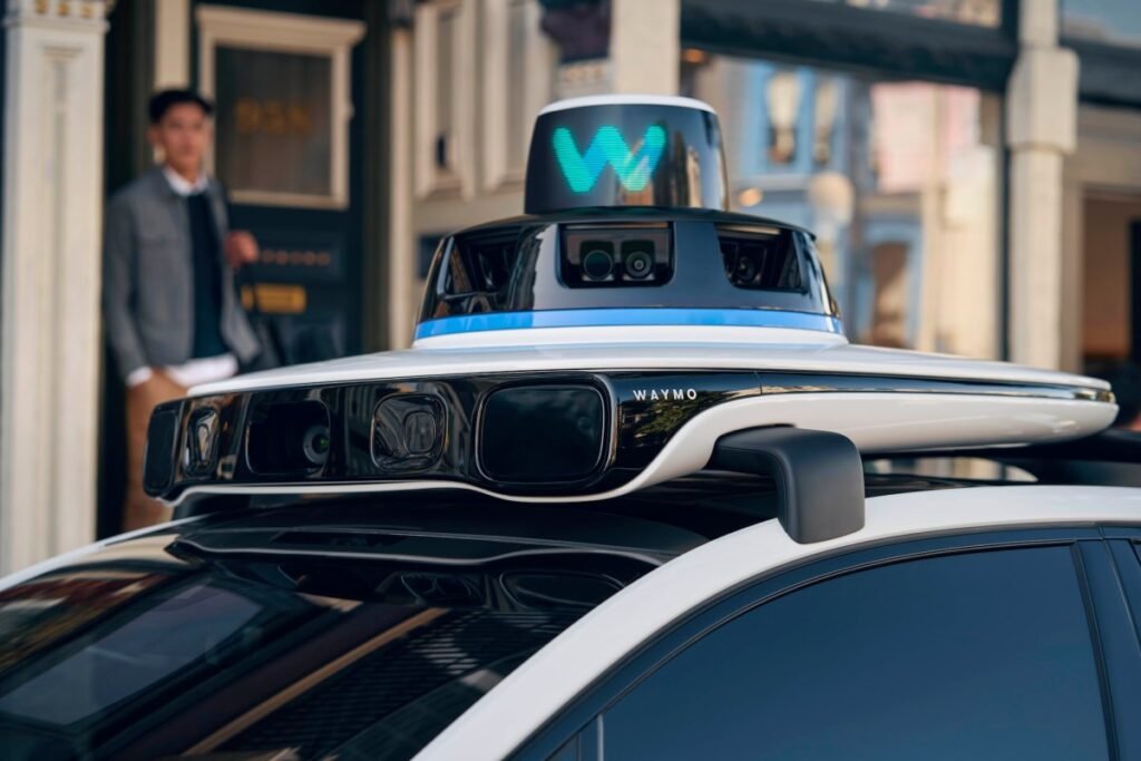 Waymo opens up robotaxi service in Dallas to everyone A close up of the rooftop of a Waymo robotaxi that shows sensors.