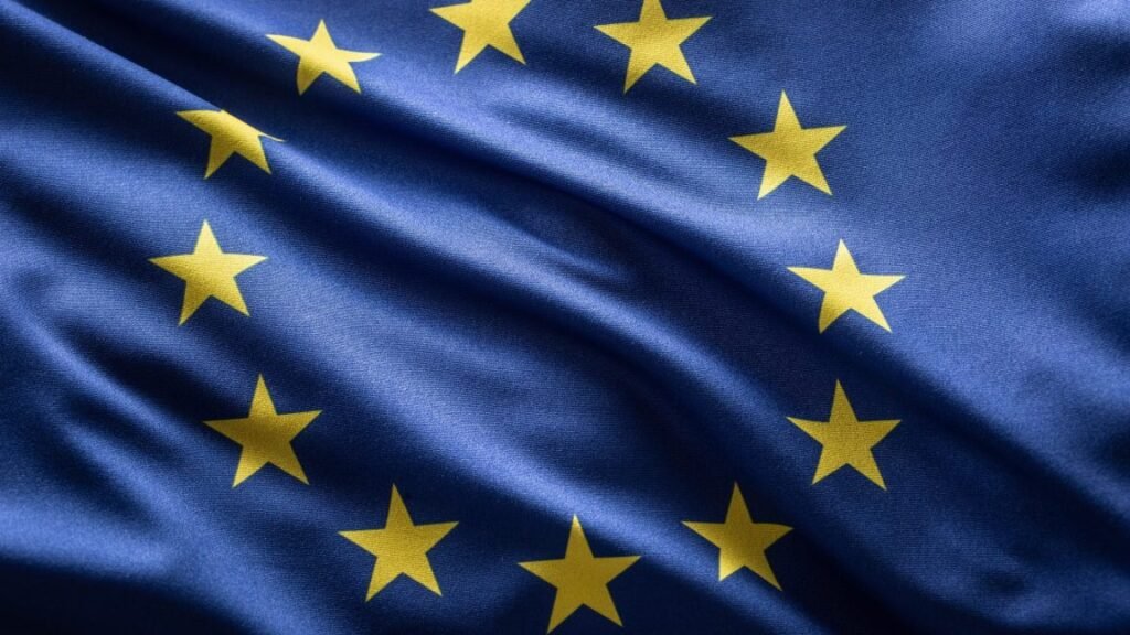 A European Union flag blowing in the wind.