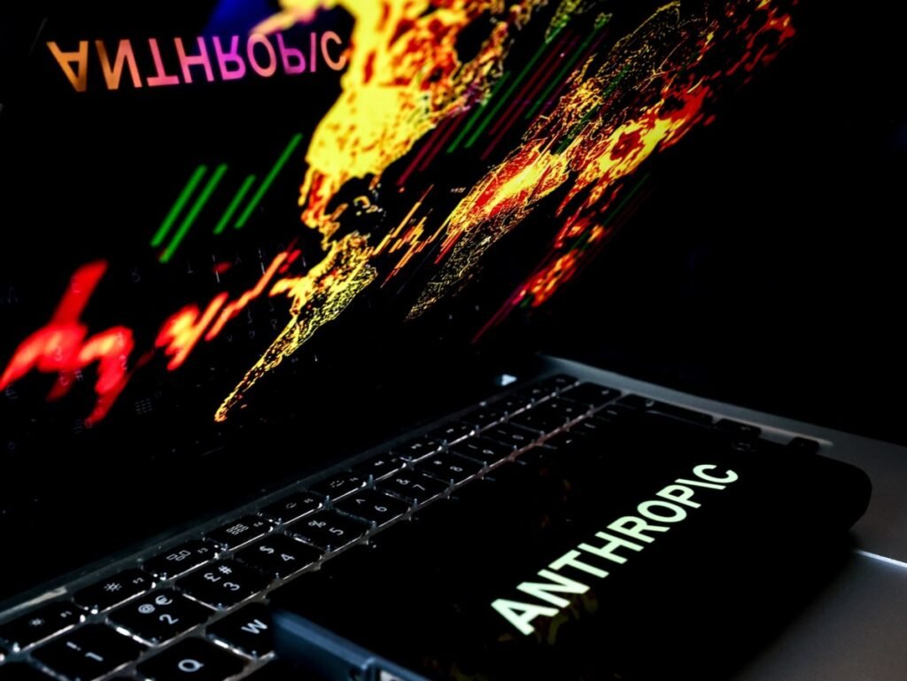 In this photo illustration, the Anthropic logo is displayed on a mobile phone screen against a world map.