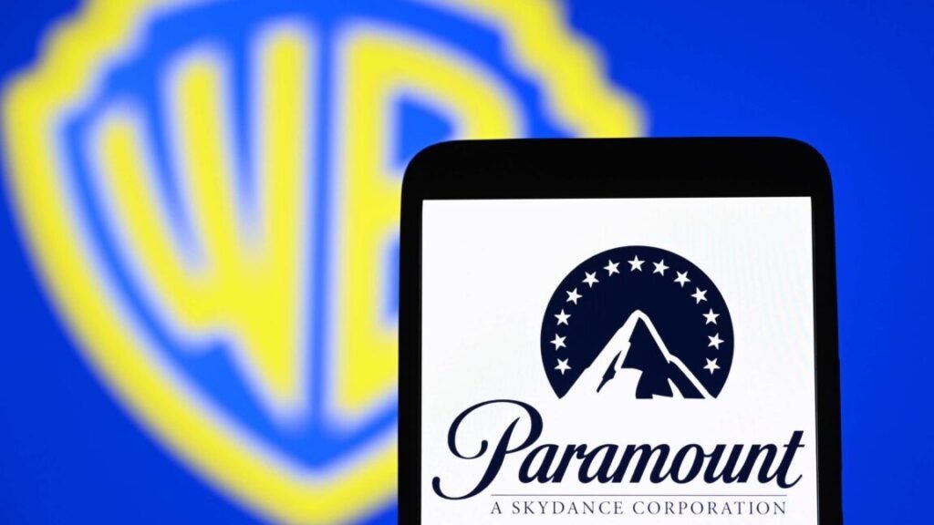 California settles lawsuit against Paramount/Warner merger, angering advocates Paramount's logo displayed on a smartphone in front of a backdrop with the Warner Bros. logo