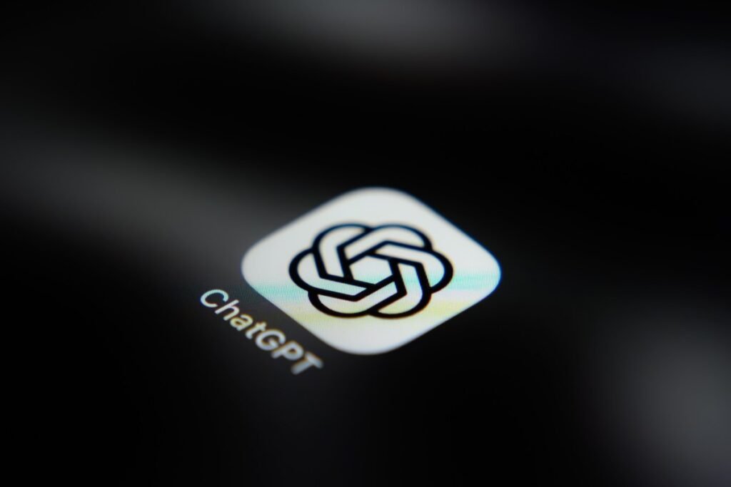 ChatGPT mobile app gets voice-based agentic features The ChatGPT application icon is displayed on a smartphone screen.