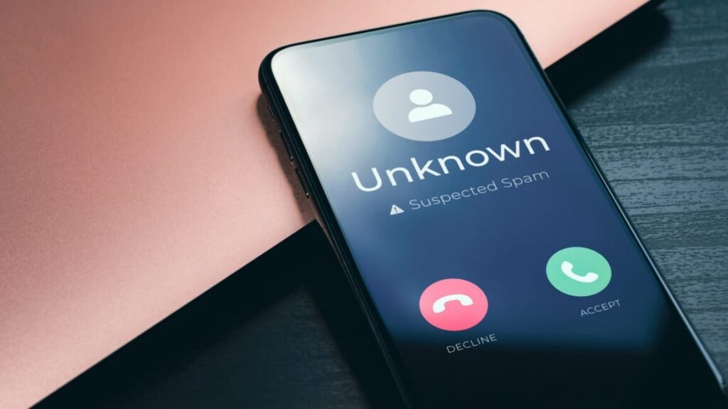 Incoming call on a smartphone screen labeled as "Unknown, suspected spam"